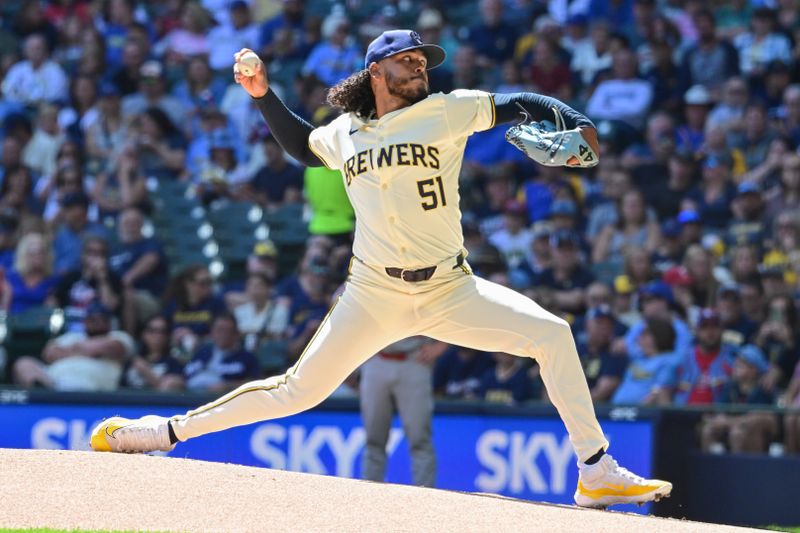 Sep 2, 2024; Milwaukee, Wisconsin, USA; Milwaukee Brewers starting pitcher Freddy Peralta (51) pitches in the first inning against the St. Louis Cardinals at American Family Field. Mandatory Credit: Benny Sieu-USA TODAY Sports