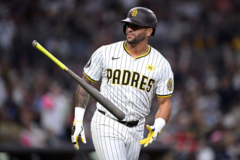 Sep 21, 2024; San Diego, California, USA; San Diego Padres designated hitter David Peralta (24) tosses his bat after hitting a home run against the Chicago White Sox during the fourth inning at Petco Park. Mandatory Credit: Orlando Ramirez-Imagn Images