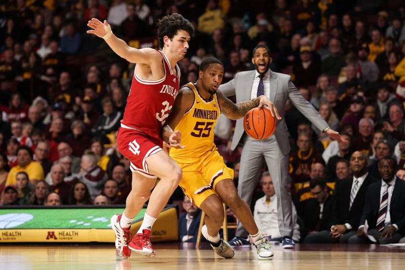 Jan 25, 2023; Minneapolis, Minnesota, USA; Minnesota Golden Gophers guard Ta'lon Cooper (55) dribbles while Indiana Hoosiers guard Trey Galloway (32) defends during the first half at Williams Arena. Mandatory Credit: Matt Krohn-USA TODAY Sports