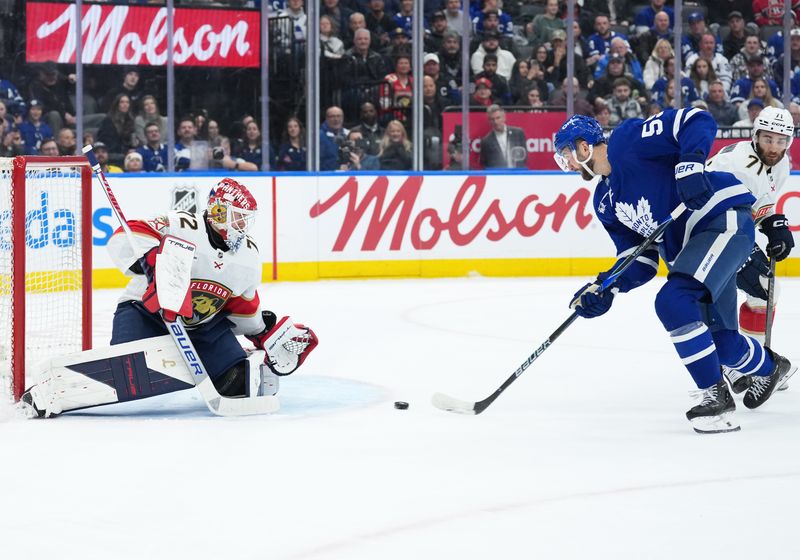Jan 6, 2026; Toronto, Ontario, CAN; Toronto Maple Leafs center Nicolas Roy (55) attempts a shot on Florida Panthers goaltender Sergei Bobrovsky (72) during the first period at Scotiabank Arena. Mandatory Credit: Nick Turchiaro-Imagn Images