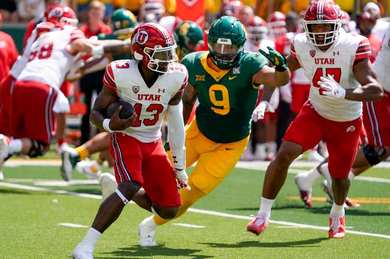 Sep 9, 2023; Waco, Texas, USA; Utah Utes quarterback Nate Johnson (13) is tracked down by Baylor Bears defensive lineman TJ Franklin (9) during the first half at McLane Stadium. Mandatory Credit: Raymond Carlin III-USA TODAY Sports