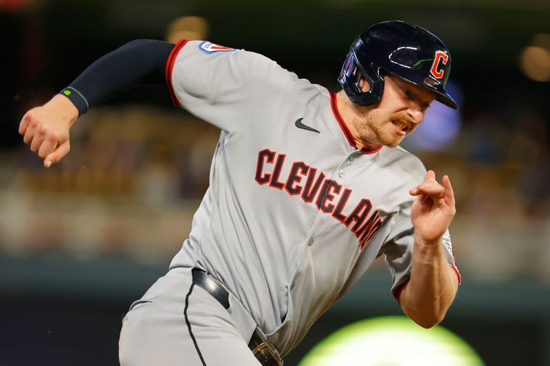 Sep 19, 2025; Minneapolis, Minnesota, USA; Cleveland Guardians first baseman Kyle Manzardo (9) rounds third and scores against the Minnesota Twins on a single by catcher Bo Naylor (not pictured) in the eighth inning at Target Field. Mandatory Credit: Bruce Kluckhohn-Imagn Images