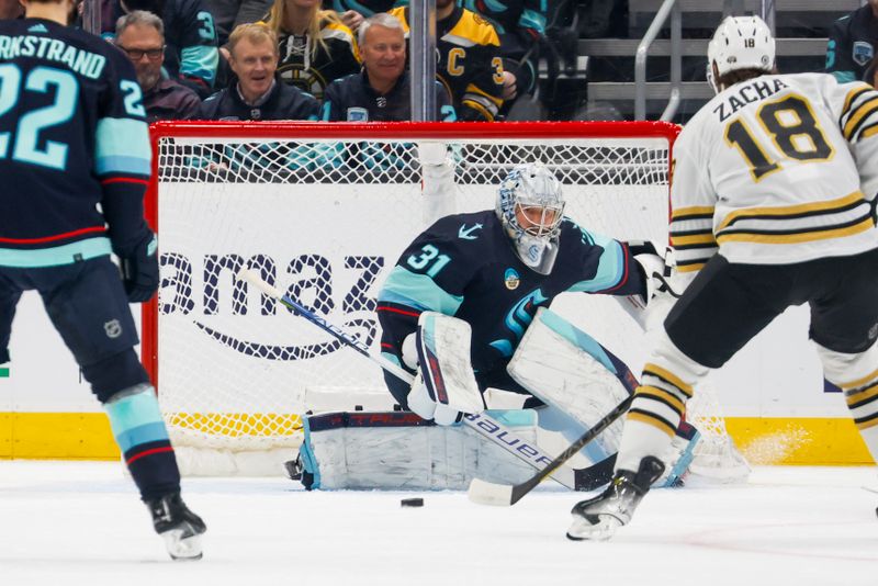 Feb 26, 2024; Seattle, Washington, USA; Seattle Kraken goaltender Philipp Grubauer (31) follows the puck across the crease against the Boston Bruins during the first period at Climate Pledge Arena. Mandatory Credit: Joe Nicholson-USA TODAY Sports