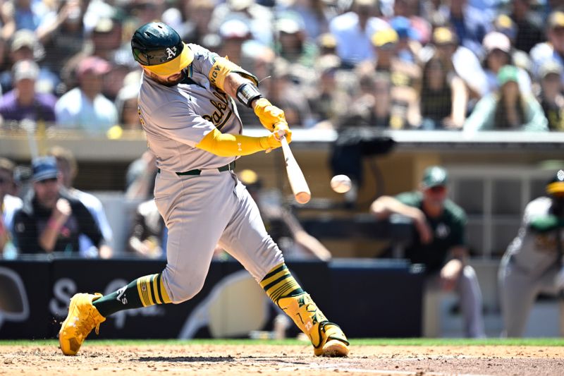 Jun 12, 2024; San Diego, California, USA; Oakland Athletics catcher Shea Langeliers (23) hits an RBI single against the San Diego Padres during the sixth inning at Petco Park. Mandatory Credit: Orlando Ramirez-USA TODAY Sports