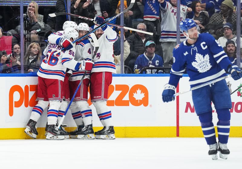 Dec 19, 2023; Toronto, Ontario, CAN; New York Rangers defenseman Braden Schneider (4) scores a goal and celebrates with New York Rangers center Mika Zibanejad (93) against the Toronto Maple Leafs during the third period at Scotiabank Arena. Mandatory Credit: Nick Turchiaro-USA TODAY Sports