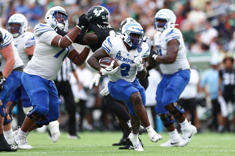 Oct 12, 2024; Orlando, Florida, USA; Memphis Tigers running back Mario Anderson Jr. (2) runs with the ball against the South Florida Bulls in the first quarter at Camping World Stadium. Mandatory Credit: Nathan Ray Seebeck-Imagn Images