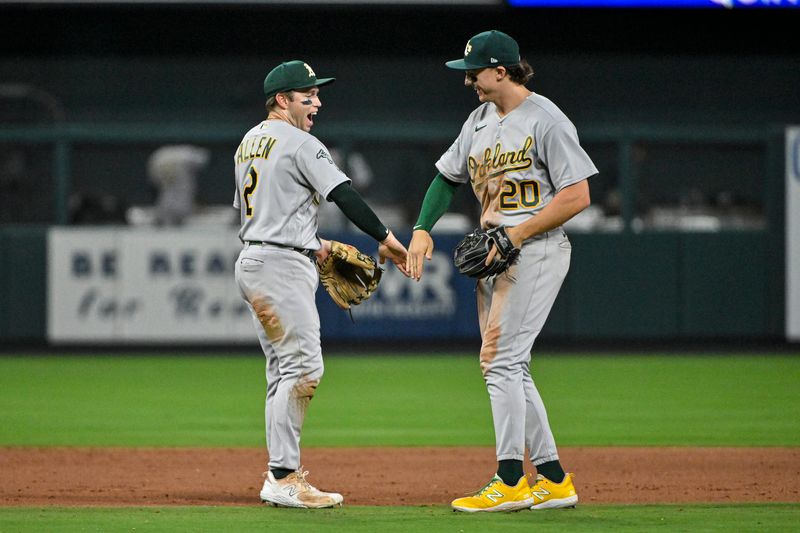 Aug 16, 2023; St. Louis, Missouri, USA;  Oakland Athletics shortstop Nick Allen (2) and second baseman Zack Gelof (20) celebrate after the Athletics defeated the St. Louis Cardinals at Busch Stadium. Mandatory Credit: Jeff Curry-USA TODAY Sports