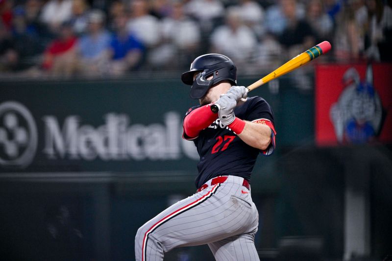 Aug 18, 2024; Arlington, Texas, USA; Minnesota Twins catcher Ryan Jeffers (27) hits a single and drives in a run against the Texas Rangers during the third inning at Globe Life Field. Mandatory Credit: Jerome Miron-USA TODAY Sports