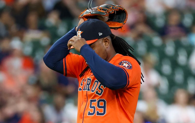 Sep 6, 2024; Houston, Texas, USA;  Houston Astros starting pitcher Framber Valdez (59) pitches against the Arizona Diamondbacks in the first inning at Minute Maid Park. Mandatory Credit: Thomas Shea-Imagn Images