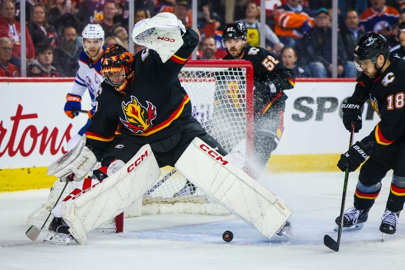 Apr 6, 2024; Calgary, Alberta, CAN; Calgary Flames goaltender Jacob Markstrom (25) makes a save against the Edmonton Oilers during the first period at Scotiabank Saddledome. Mandatory Credit: Sergei Belski-USA TODAY Sports