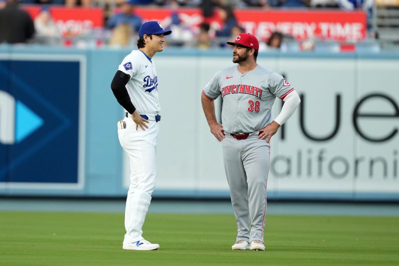 May 16, 2024; Los Angeles, California, USA; Los Angeles Dodgers designated hitter Shohei Ohtani (17) talks with Cincinnati Reds first baseman Mike Ford (38) during the game at Dodger Stadium. Mandatory Credit: Kirby Lee-USA TODAY Sports