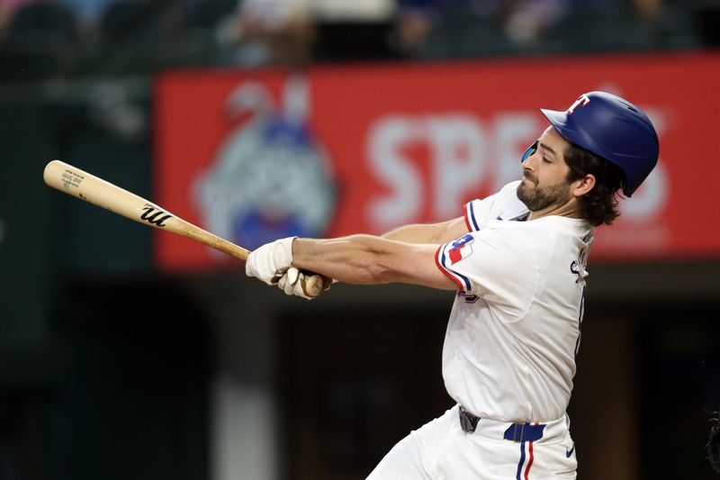 Jun 22, 2024; Arlington, Texas, USA; Texas Rangers third base Josh Smith (8) hits a fly ball in the first inning against the Kansas City Royals at Globe Life Field. Mandatory Credit: Tim Heitman-USA TODAY Sports