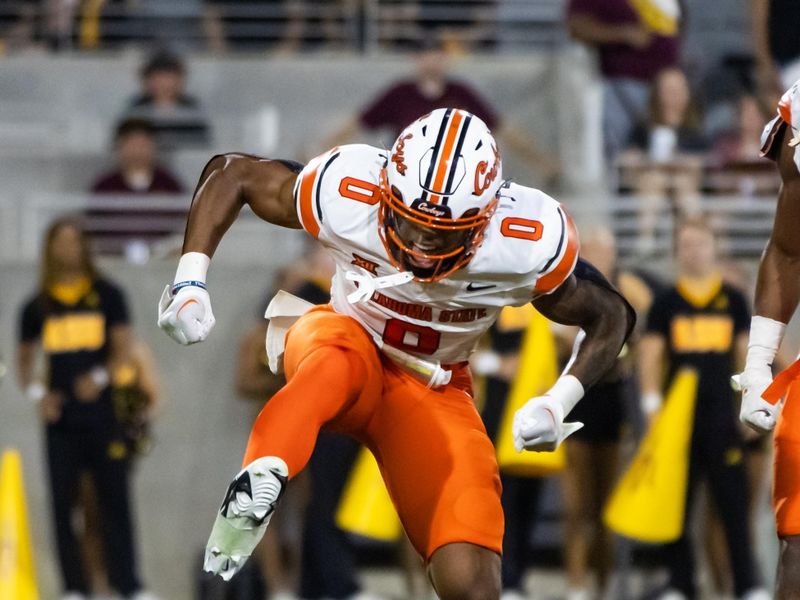 Sep 9, 2023; Tempe, Arizona, USA; Oklahoma State Cowboys running back Ollie Gordon II (0) celebrates a touchdown against the Arizona State Sun Devils in the first half at Mountain America Stadium. Mandatory Credit: Mark J. Rebilas-USA TODAY Sports