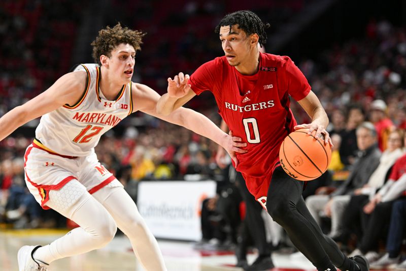 Feb 6, 2024; College Park, Maryland, USA; Rutgers Scarlet Knights guard Derek Simpson (0) makes a  move to the basket on Maryland Terrapins forward Jamie Kaiser Jr. (12) during the first half  at Xfinity Center. Mandatory Credit: Tommy Gilligan-USA TODAY Sports