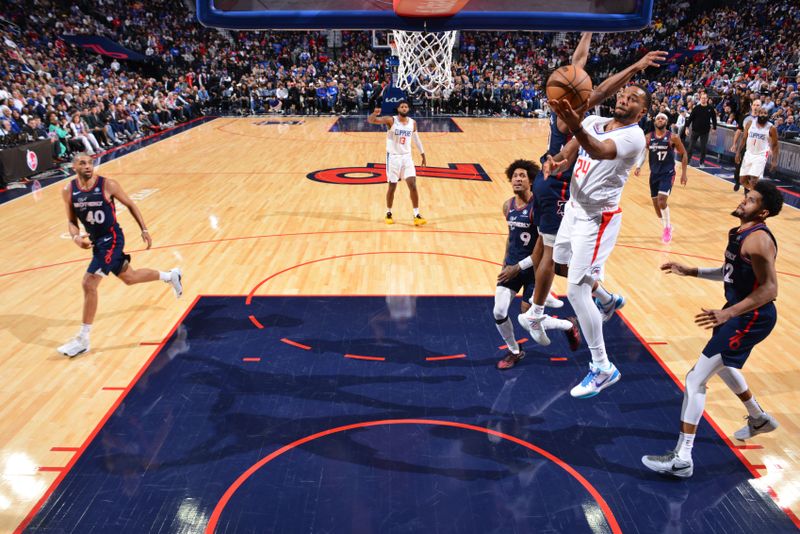 PHILADELPHIA, PA - MARCH 27: Norman Powell #24 of the LA Clippers drives to the basket during the game against the Philadelphia 76ers on March 27, 2024 at the Wells Fargo Center in Philadelphia, Pennsylvania NOTE TO USER: User expressly acknowledges and agrees that, by downloading and/or using this Photograph, user is consenting to the terms and conditions of the Getty Images License Agreement. Mandatory Copyright Notice: Copyright 2024 NBAE (Photo by Jesse D. Garrabrant/NBAE via Getty Images)