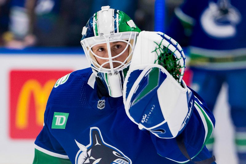 Nov 30, 2023; Vancouver, British Columbia, CAN; Vancouver Canucks goalie Casey DeSmith (29) makes a save during warm up prior to a game against the Vegas Golden Knights at Rogers Arena. Mandatory Credit: Bob Frid-USA TODAY Sports