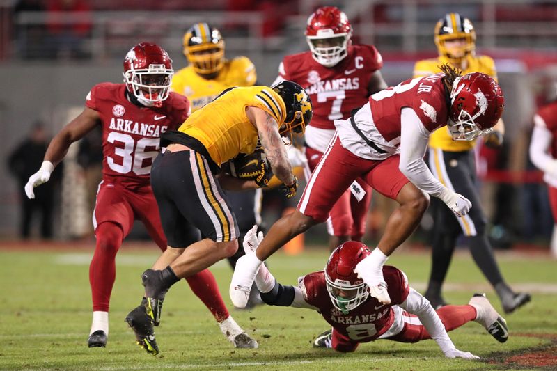 Nov 24, 2023; Fayetteville, Arkansas, USA; Missouri Tigers running back Cody Schrader (7) rushes during the second half against the Arkansas Razorbacks at Donald W. Reynolds Razorback Stadium. Missouri won 48-14. Mandatory Credit: Nelson Chenault-USA TODAY Sports