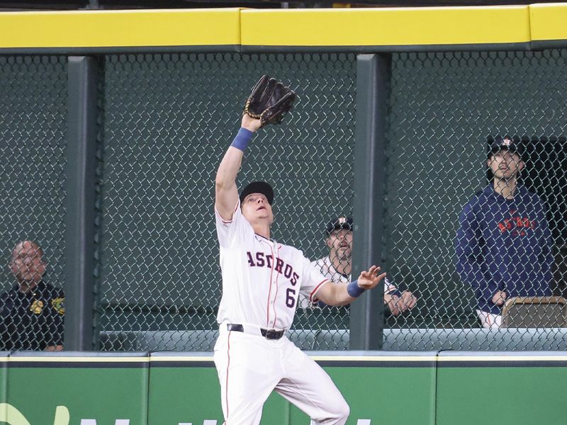 Jun 5, 2024; Houston, Texas, USA; Houston Astros center fielder Jake Meyers (6) leaps to make a catch during the eighth inning against the St. Louis Cardinals at Minute Maid Park. Mandatory Credit: Troy Taormina-USA TODAY Sports