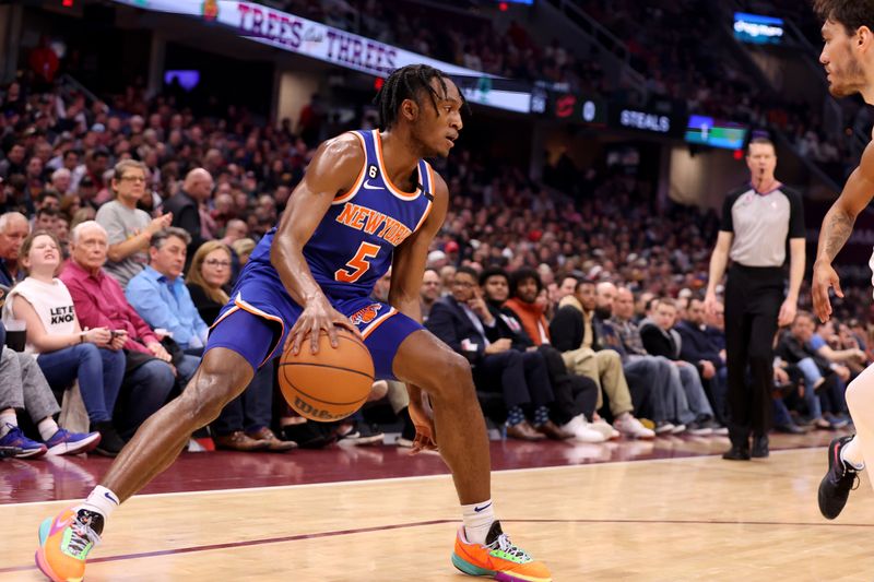 CLEVELAND, OH - MARCH 31: Immanuel Quickley #5 of the New York Knicks handles the ball during the game against the Cleveland Cavaliers on March 31, 2023 at Rocket Mortgage FieldHouse in Cleveland, Ohio. NOTE TO USER: User expressly acknowledges and agrees that, by downloading and/or using this Photograph, user is consenting to the terms and conditions of the Getty Images License Agreement. Mandatory Copyright Notice: Copyright 2023 NBAE (Photo by  Lauren Leigh Bacho/NBAE via Getty Images)