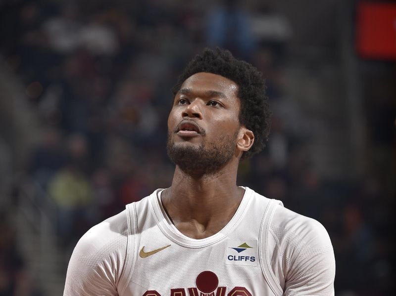 CLEVELAND, OH - MARCH 11:  Damian Jones #30 of the Cleveland Cavaliers shoots a free throw during the game against the Phoenix Suns on March 11, 2024 at Rocket Mortgage FieldHouse in Cleveland, Ohio. NOTE TO USER: User expressly acknowledges and agrees that, by downloading and/or using this Photograph, user is consenting to the terms and conditions of the Getty Images License Agreement. Mandatory Copyright Notice: Copyright 2024 NBAE (Photo by David Liam Kyle/NBAE via Getty Images)