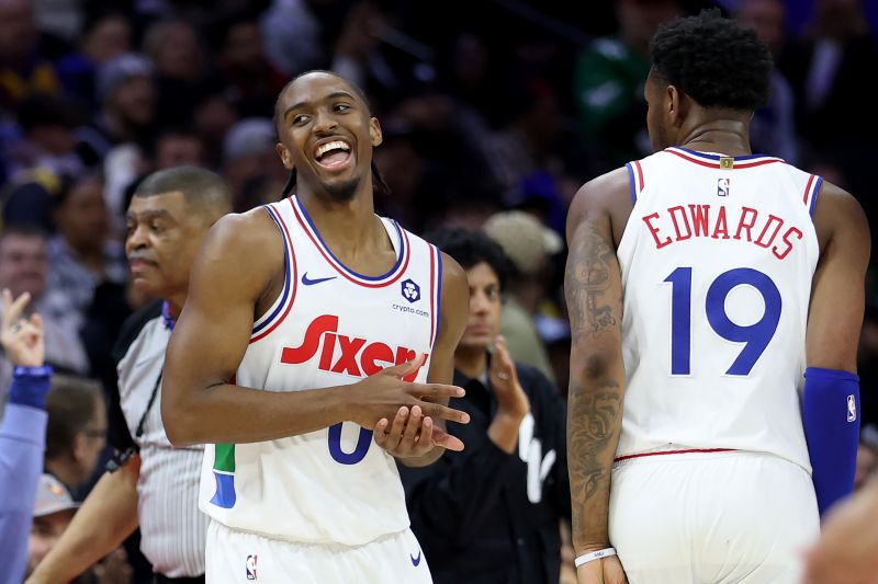 PHILADELPHIA, PENNSYLVANIA - JANUARY 28: Tyrese Maxey #0 of the Philadelphia 76ers celebrates a three-pointer with Justin Edwards #19 during the second half against the Los Angeles Lakers at the Wells Fargo Center on January 28, 2025 in Philadelphia, Pennsylvania. NOTE TO USER: User expressly acknowledges and agrees that, by downloading and or using this photograph, User is consenting to the terms and conditions of the Getty Images License Agreement. (Photo by Emilee Chinn/Getty Images)