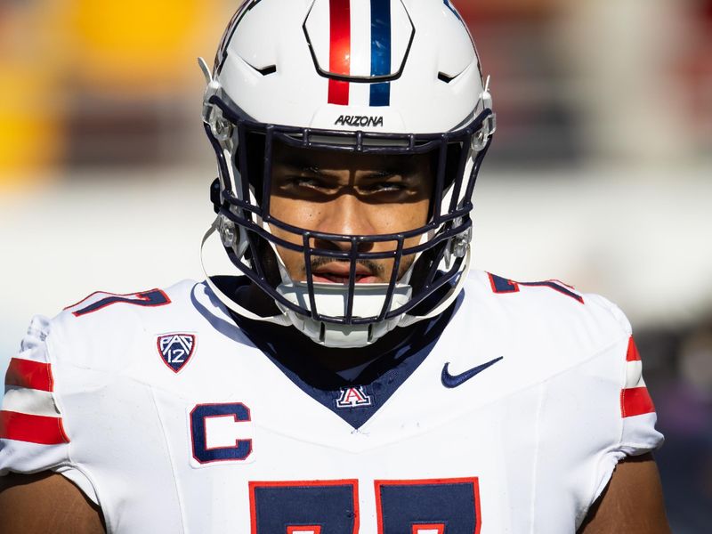 Nov 25, 2023; Tempe, Arizona, USA; Arizona Wildcats offensive lineman Jordan Morgan (77) against the Arizona State Sun Devils during the Territorial Cup at Mountain America Stadium. Mandatory Credit: Mark J. Rebilas-USA TODAY Sports