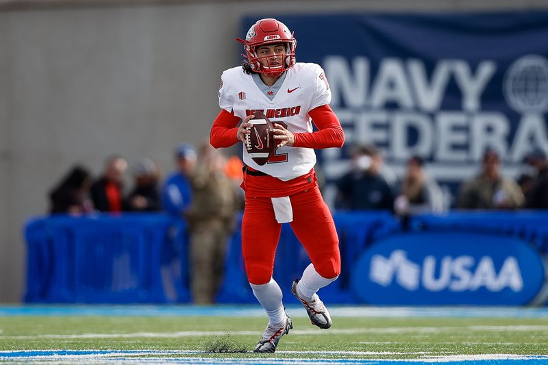 Nov 12, 2022; Colorado Springs, Colorado, USA; New Mexico Lobos quarterback Justin Holaday (12) scrambles in the backfield in the second quarter against the Air Force Falcons at Falcon Stadium. Mandatory Credit: Isaiah J. Downing-USA TODAY Sports