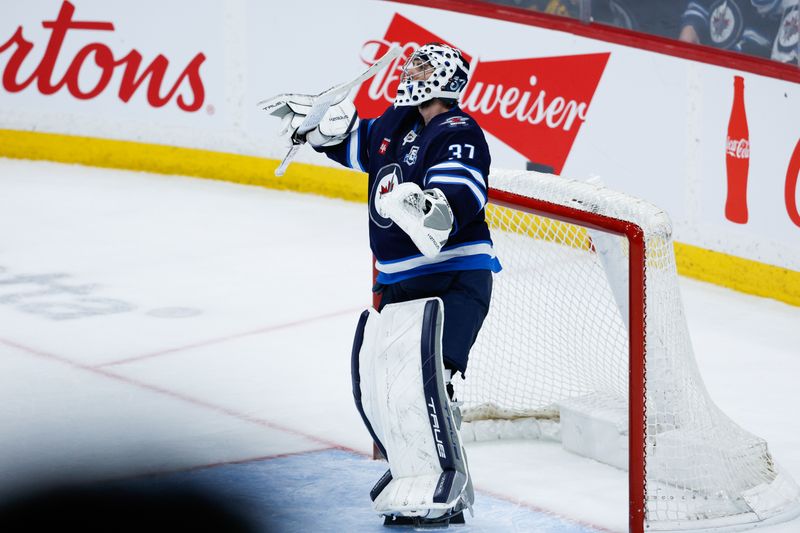 Mar 5, 2026; Winnipeg, Manitoba, CAN;  Winnipeg Jets goalie Connor Hellebuyck (37) celebrates his win against the Tampa Bay Lightning during the third period at Canada Life Centre. Mandatory Credit: Terrence Lee-Imagn Images