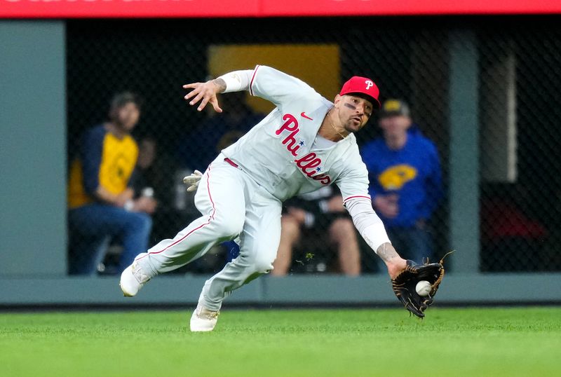 May 12, 2023; Denver, Colorado, USA; Philadelphia Phillies right fielder Nick Castellanos (8) fields the ball in the fifth inning against the Philadelphia Phillies at Coors Field. Mandatory Credit: Ron Chenoy-USA TODAY Sports