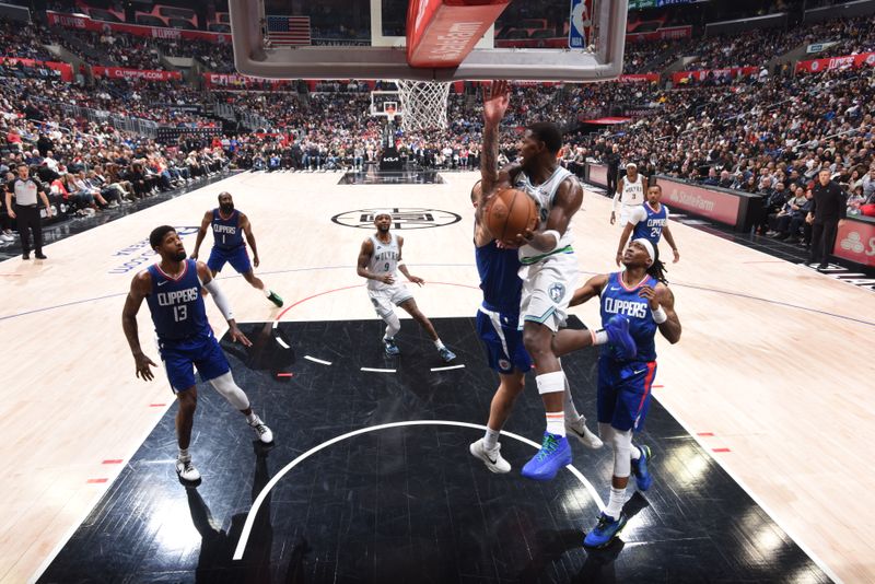 LOS ANGELES, CA - MARCH 12:  Anthony Edwards #5 of the Minnesota Timberwolves passes the ball during the game against the LA Clippers on March 12, 2024 at Crypto.Com Arena in Los Angeles, California. NOTE TO USER: User expressly acknowledges and agrees that, by downloading and/or using this Photograph, user is consenting to the terms and conditions of the Getty Images License Agreement. Mandatory Copyright Notice: Copyright 2024 NBAE (Photo by Tyler Ross/NBAE via Getty Images)