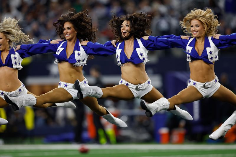 Dallas Cowboys cheerleaders perform during a pregame performance before an NFL football game against the Philadelphia Eagles, Sunday, Dec. 10, 2023, in Arlington, Texas. (AP Photo/Matt Patterson)