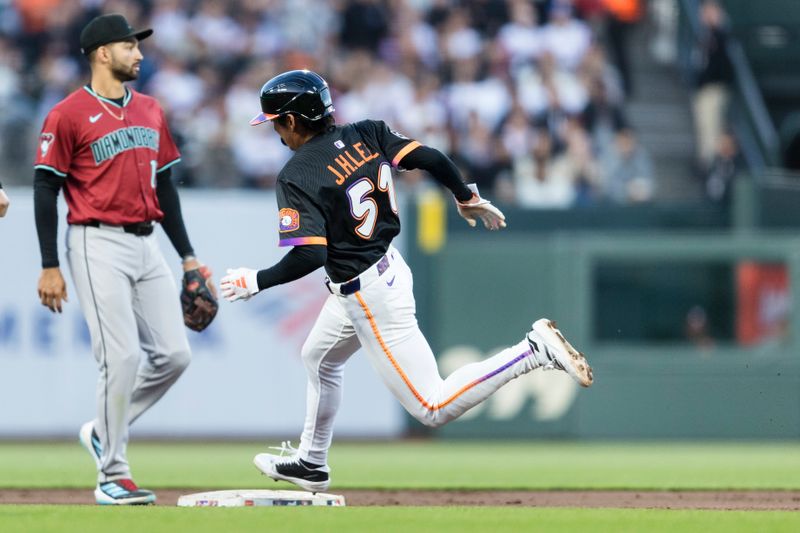 May 13, 2025; San Francisco, California, USA; San Francisco Giants center fielder Jung Hoo Lee (51) rounds second base against the Arizona Diamondbacks during the third inning at Oracle Park. Mandatory Credit: John Hefti-Imagn Images