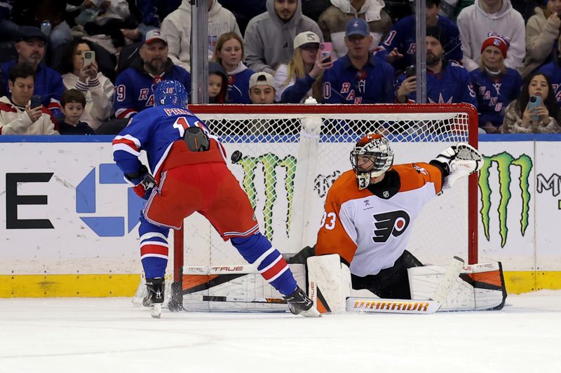 Dec 20, 2025; New York, New York, USA; New York Rangers left wing Artemi Panarin (10) scores against Philadelphia Flyers goaltender Samuel Ersson (33) during the shootout at Madison Square Garden. Mandatory Credit: Brad Penner-Imagn Images