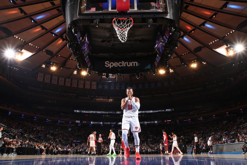 NEW YORK, NY - OCTOBER 9: Jalen Brunson #11 of the New York Knicks looks on before the game against the Washington Wizards during the 2024 NBA Preseason on October 9, 2024 at Madison Square Garden in New York City, New York.  NOTE TO USER: User expressly acknowledges and agrees that, by downloading and or using this photograph, User is consenting to the terms and conditions of the Getty Images License Agreement. Mandatory Copyright Notice: Copyright 2024 NBAE  (Photo by Nathaniel S. Butler/NBAE via Getty Images)
