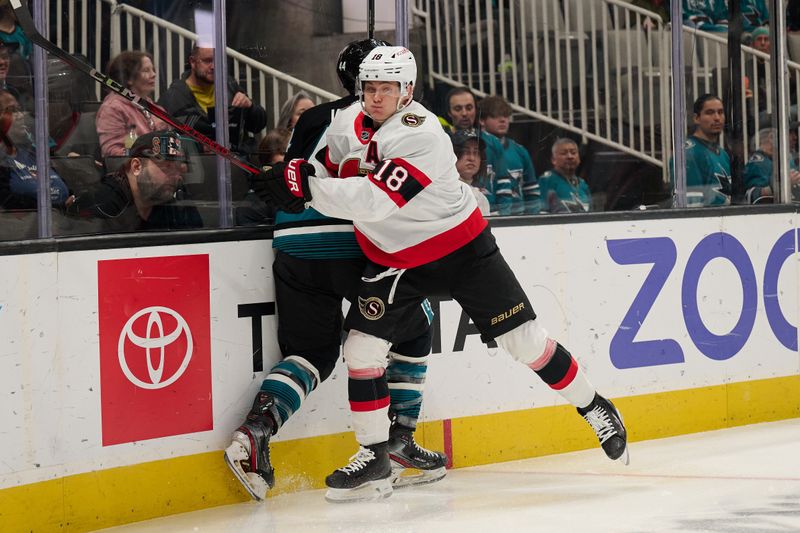 Mar 9, 2024; San Jose, California, USA: Ottawa Senators center Tim Stutzle (18) checks San Jose Sharks defenseman Marc-Edouard Vlasic (44) against the boards during the first period at SAP Center at San Jose. Mandatory Credit: Robert Edwards-USA TODAY Sports