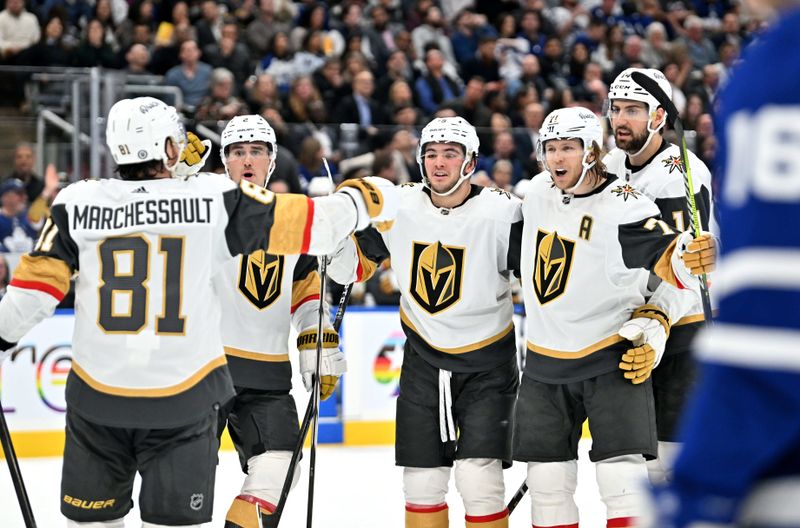 Feb 27, 2024; Toronto, Ontario, CAN;  Vegas Golden Knights forward William Karlsson (71) celebrates with forwards Brendan Brisson (19) and Jonathan Marchessault (81) and defensemen Nicolas Hague (14) and Zach Whitehead (2) after scoring a goal against the Toronto Maple Leafs in the second period at Scotiabank Arena. Mandatory Credit: Dan Hamilton-USA TODAY Sports