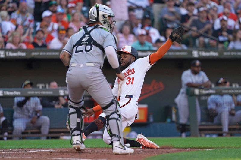 Sep 2, 2024; Baltimore, Maryland, USA; Baltimore Orioles outfielder Cedric Mullins (31) scores during the sixth inning against the Chicago White Sox at Oriole Park at Camden Yards. Mandatory Credit: Mitch Stringer-USA TODAY Sports