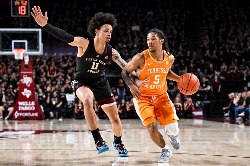 Feb 21, 2023; College Station, Texas, USA;  Tennessee Volunteers guard Zakai Zeigler (5) drives to the basket as Texas A&M Aggies forward Andersson Garcia (11) defends during the first half at Reed Arena. Mandatory Credit: Maria Lysaker-USA TODAY Sports