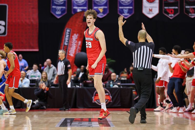 Nov 28, 2025; Kissimmee, FL, USA; Dayton Flyers forward Amael L'Etang (29) reacts after making a three point shot against the Brigham Young University Cougars in the first half during the ESPN Events Invitational at State Farm Field House. Mandatory Credit: Nathan Ray Seebeck-Imagn Images