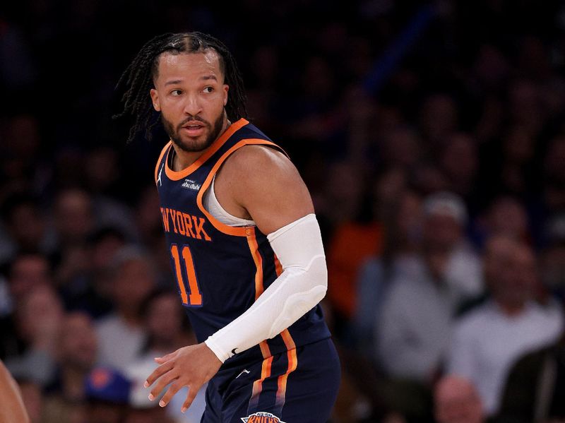 NEW YORK, NEW YORK - NOVEMBER 08:  Jalen Brunson #11 of the New York Knicks reacts in the second half against the Milwaukee Bucks at Madison Square Garden on November 08, 2024 in New York City. NOTE TO USER: User expressly acknowledges and agrees that, by downloading and or using this photograph, User is consenting to the terms and conditions of the Getty Images License Agreement. (Photo by Elsa/Getty Images)