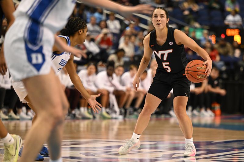 Mar 4, 2023; Greensboro, NC, USA; Virginia Tech Hokies guard Georgia Amoore (5) dribbles as Duke Blue Devils guard Ashlon Jackson (3) guards during the first half at Greensboro Coliseum. Mandatory Credit: William Howard-USA TODAY Sports