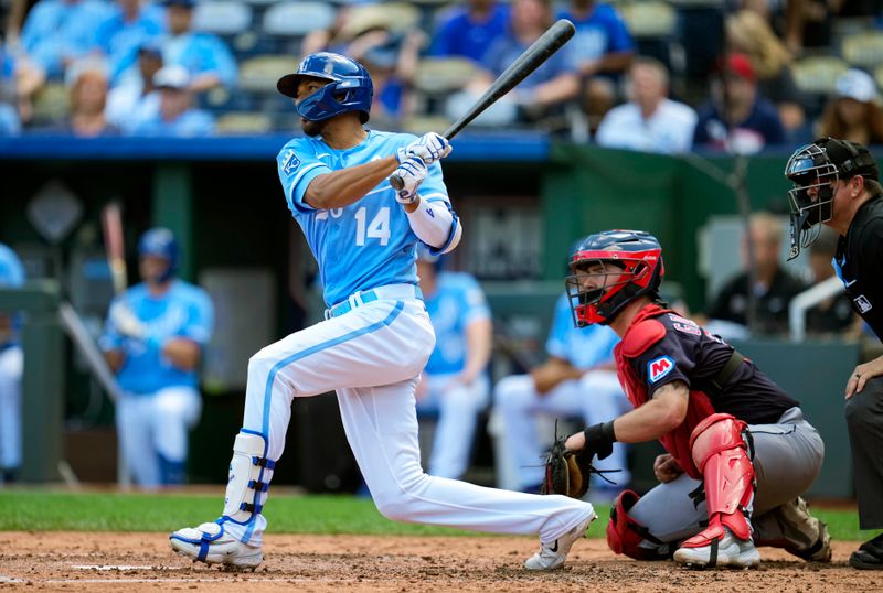 Sep 20, 2023; Kansas City, Missouri, USA; Kansas City Royals left fielder Edward Olivares (14) hits a single against the Cleveland Guardians during the third inning at Kauffman Stadium. Mandatory Credit: Jay Biggerstaff-USA TODAY Sports