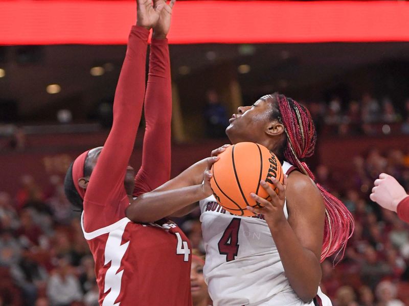 Mar 3, 2023; Greenville, SC, USA; South Carolina forward Aliyah Boston (4) shoots near Arkansas forward Erin Barnum (4) during the first quarter at Bon Secours Wellness Arena. Mandatory Credit: Ken Ruinard-USA TODAY Sports