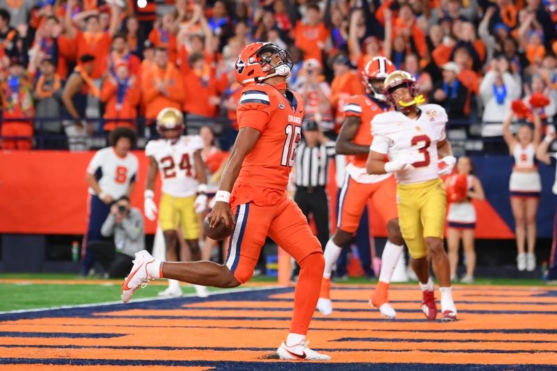 Nov 3, 2023; Syracuse, New York, USA; Syracuse Orange quarterback Carlos Del Rio-Wilson (16) celebrates as he scores a touchdown against the Boston College Eagles during the first half at the JMA Wireless Dome. Mandatory Credit: Rich Barnes-USA TODAY Sports