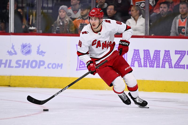 Nov 28, 2023; Philadelphia, Pennsylvania, USA; Carolina Hurricanes center Martin Necas (88) controls the puck against the Philadelphia Flyers in the second period at Wells Fargo Center. Mandatory Credit: Kyle Ross-USA TODAY Sports