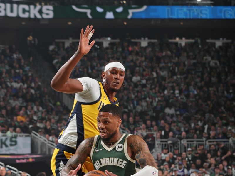 MILWAUKEE, WI - APRIL 21: Damian Lillard #0 of the Milwaukee Bucks drives to the basket during the game against the Indiana Pacers during Round 1 Game 1 of the 2024 NBA Playoffs on April 21, 2024 at the Fiserv Forum Center in Milwaukee, Wisconsin. NOTE TO USER: User expressly acknowledges and agrees that, by downloading and or using this Photograph, user is consenting to the terms and conditions of the Getty Images License Agreement. Mandatory Copyright Notice: Copyright 2024 NBAE (Photo by Gary Dineen/NBAE via Getty Images).