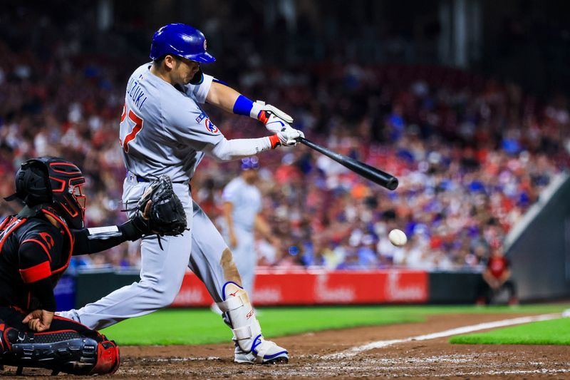 Sep 19, 2025; Cincinnati, Ohio, USA; Chicago Cubs outfielder Seiya Suzuki (27) hits a single in the seventh inning against the Cincinnati Reds at Great American Ball Park. Mandatory Credit: Katie Stratman-Imagn Images