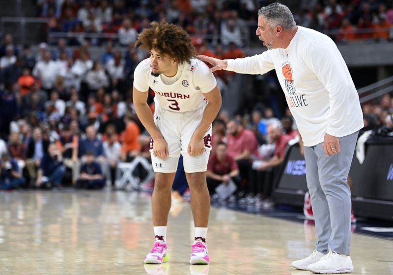 Feb 11, 2023; Auburn, Alabama, USA;  Auburn Tigers head coach Bruce Pearl talks with Auburn Tigers guard Tre Donaldson (3) at Neville Arena. Mandatory Credit: Julie Bennett-USA TODAY Sports