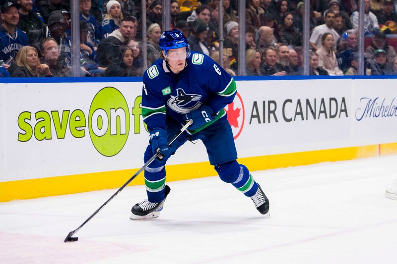 Jan 24, 2024; Vancouver, British Columbia, CAN; Vancouver Canucks forward Brock Boeser (6) handles the puck against the St. Louis Blues in the third period at Rogers Arena. Blues 4-3 in overtime. Mandatory Credit: Bob Frid-USA TODAY Sports