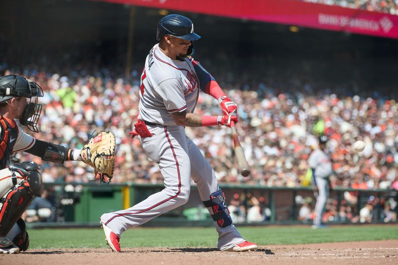 Aug 26, 2023; San Francisco, California, USA; Atlanta Braves infielder Orlando Arcia (11) hits a solo home run against the San Francisco Giants during the sixth inning at Oracle Park. Mandatory Credit: Robert Edwards-USA TODAY Sports